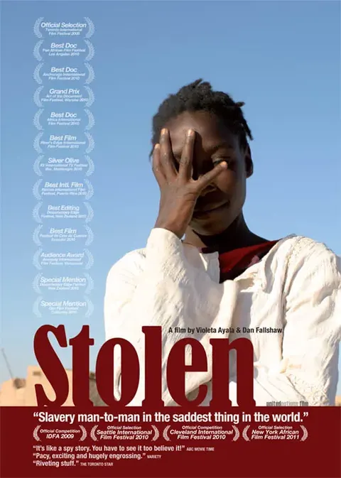 Poster of Stolen: a young man covers part of his face with his hand, above the title in red.