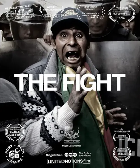 Poster of The Fight: a man shouts in front of police shields, with the title in white.