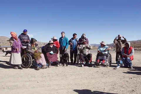 A group of marchers in wheelchairs rests on the altiplano. Still from The Fight.